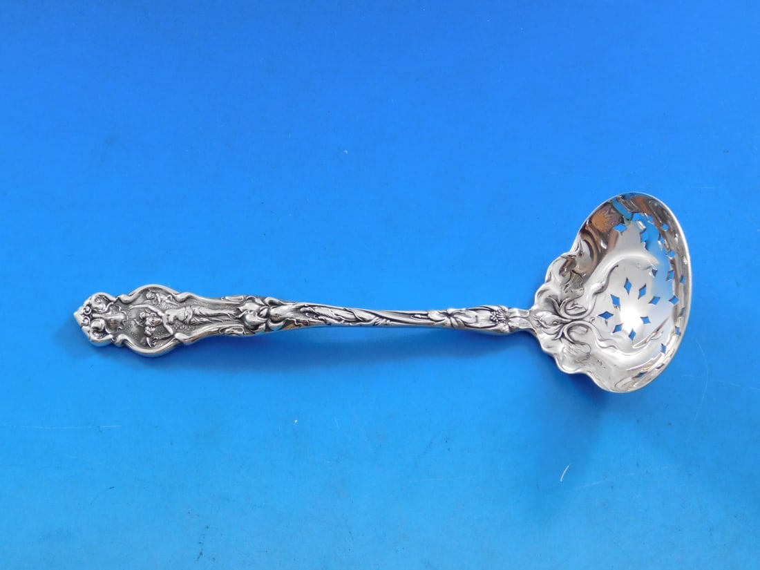 Wallace Irian Sterling Silver Sugar Sifter Ladle 5 3/4": Wallace Irian Sterling Silver Sugar Sifter Ladle 5 3/4" This exquisite sugar sifter ladle, crafted in the elegant Irian pattern by Wallace, is a stunning addition to any heirloom silverware collection