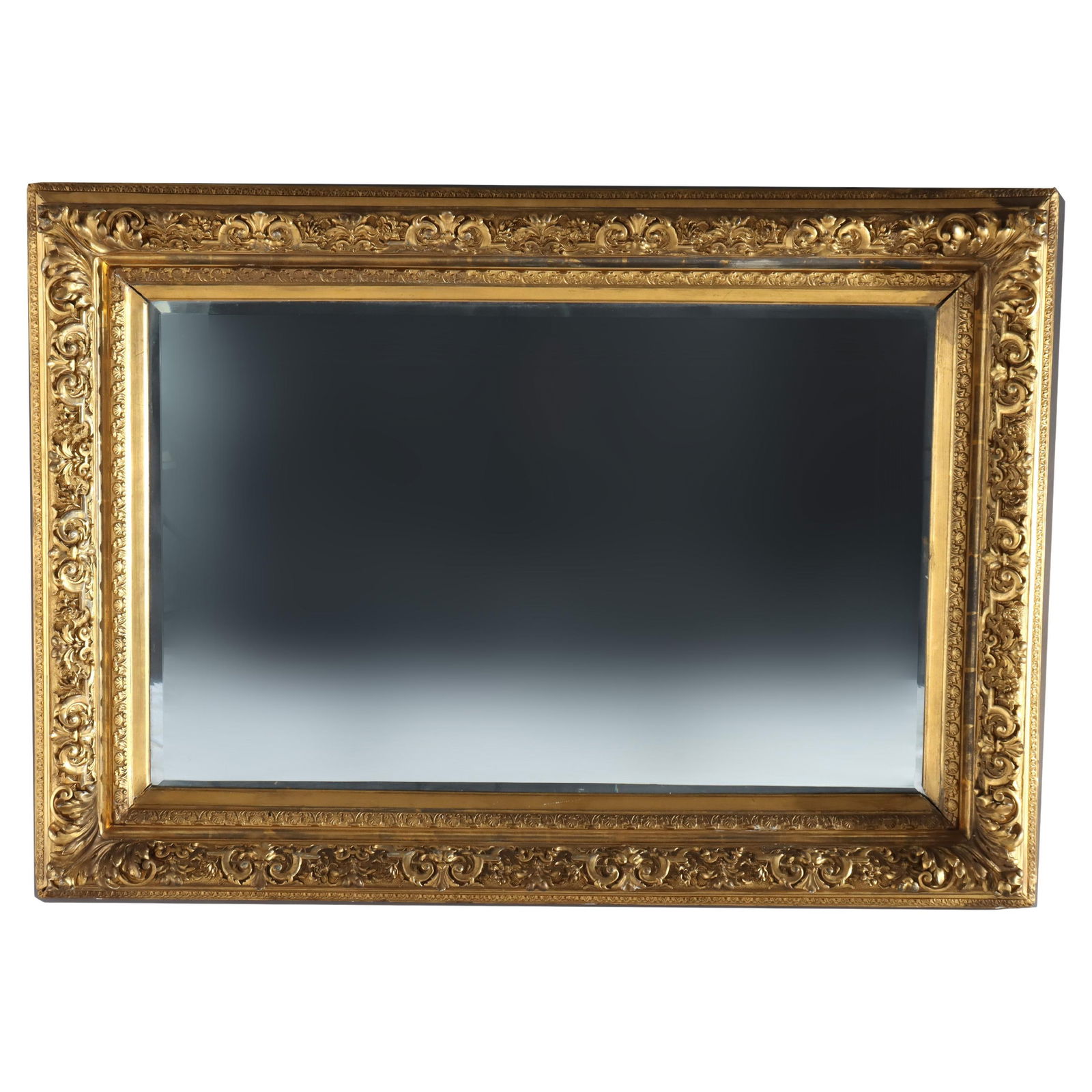 Grand Louis XIV Style Giltwood Beveled Wall Mirror C1900 38 x 54: Grand Louis XIV Style Giltwood Beveled Wall Mirror C1900 38 x 54 This impressive large wall mirror embodies the elegance of the Louis XIV style, featuring a beautifully carved giltwood frame. The beve