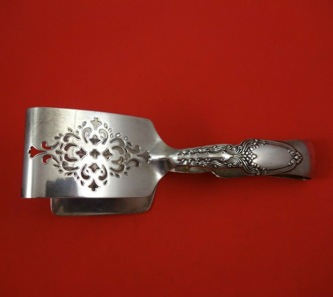 Tiffany & Co Broom Corn Sterling Silver Asparagus Tongs 7.5": Tiffany & Co Broom Corn Sterling Silver Asparagus Tongs 7.5" Discover the elegance of the Broom Corn pattern asparagus tongs by Tiffany & Co. Crafted from high-quality sterling silver, these serving p