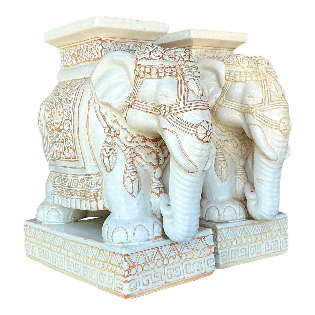 Pair of Vintage Regency Ivory Ceramic Elephant Stools: Pair of Vintage Regency Ivory Ceramic Elephant Stools Elevate your home decor with this stunning pair of Vintage Regency Glazed Ceramic Elephant Stools. Each stool showcases exquisite craftsmanship, f