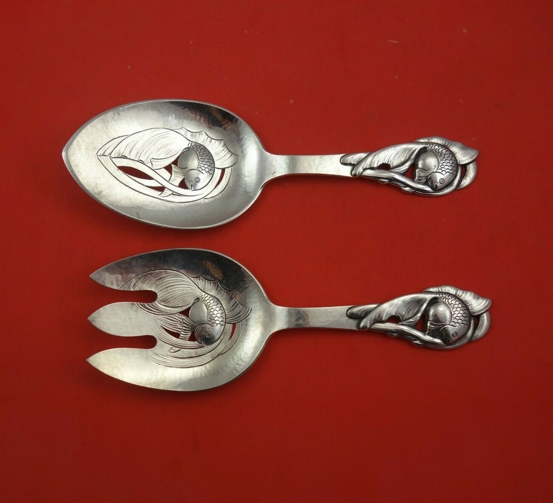 T. Nielsen Meier Sterling Silver 2pc Fish Serving Set with Goldfish Motif: T. Nielsen Meier Sterling Silver 2pc Fish Serving Set with Goldfish Motif Elevate your dining experience with this exquisite 2-piece fish serving set from T. Nielsen Meier. Crafted from high-quality s