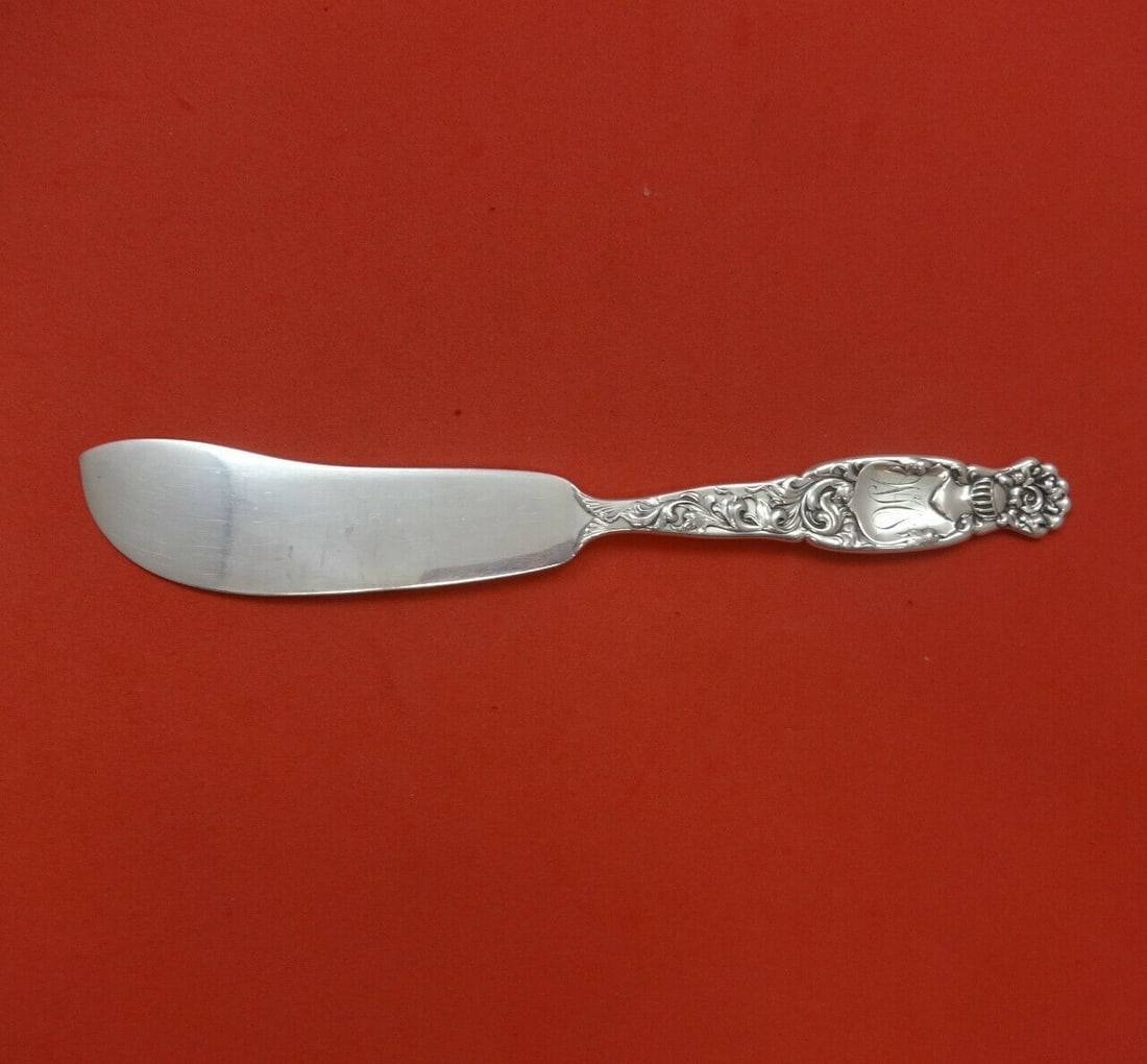 Whiting Heraldic Sterling Silver Fish Knife 7 5/8 Inch Flat Handle: Whiting Heraldic Sterling Silver Fish Knife 7 5/8 Inch Flat Handle This exquisite fish knife features a stunning flat handle and is crafted entirely from sterling silver. Designed by Whiting in the He