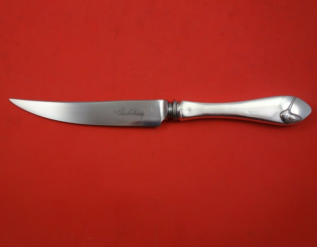 Richard E. Bishop Sterling Silver Game Birds Knife with Applied Piper 9 3/8": Richard E. Bishop Sterling Silver Game Birds Knife with Applied Piper 9 3/8" This exquisite sterling silver game knife features the intricate 'Game Birds' pattern designed by Richard E. Bishop. The kn