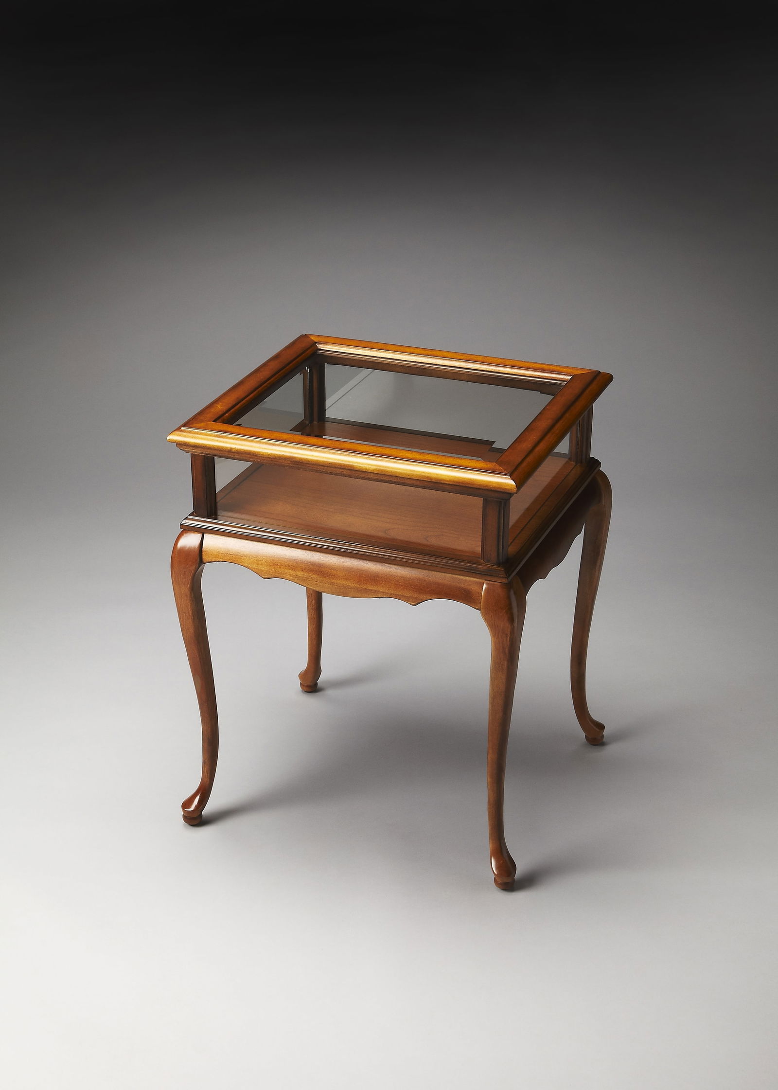 Butler Burton Formal Curio Table Cherry Veneer Olive Ash Brown: Butler Burton Formal Curio Table Cherry Veneer Olive Ash Brown This elegant Formal Curio Table from the Burton collection features a sophisticated design with a rich cherry veneer finish and a strikin