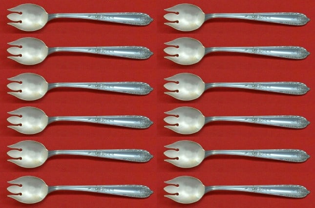 Alvin Della Robbia Sterling Silver Ice Cream Forks Set of 12: Alvin Della Robbia Sterling Silver Ice Cream Forks Set of 12 Indulge in a delightful dessert experience with this exquisite set of 12 Della Robbia ice cream forks by Alvin. Crafted from high-quality s