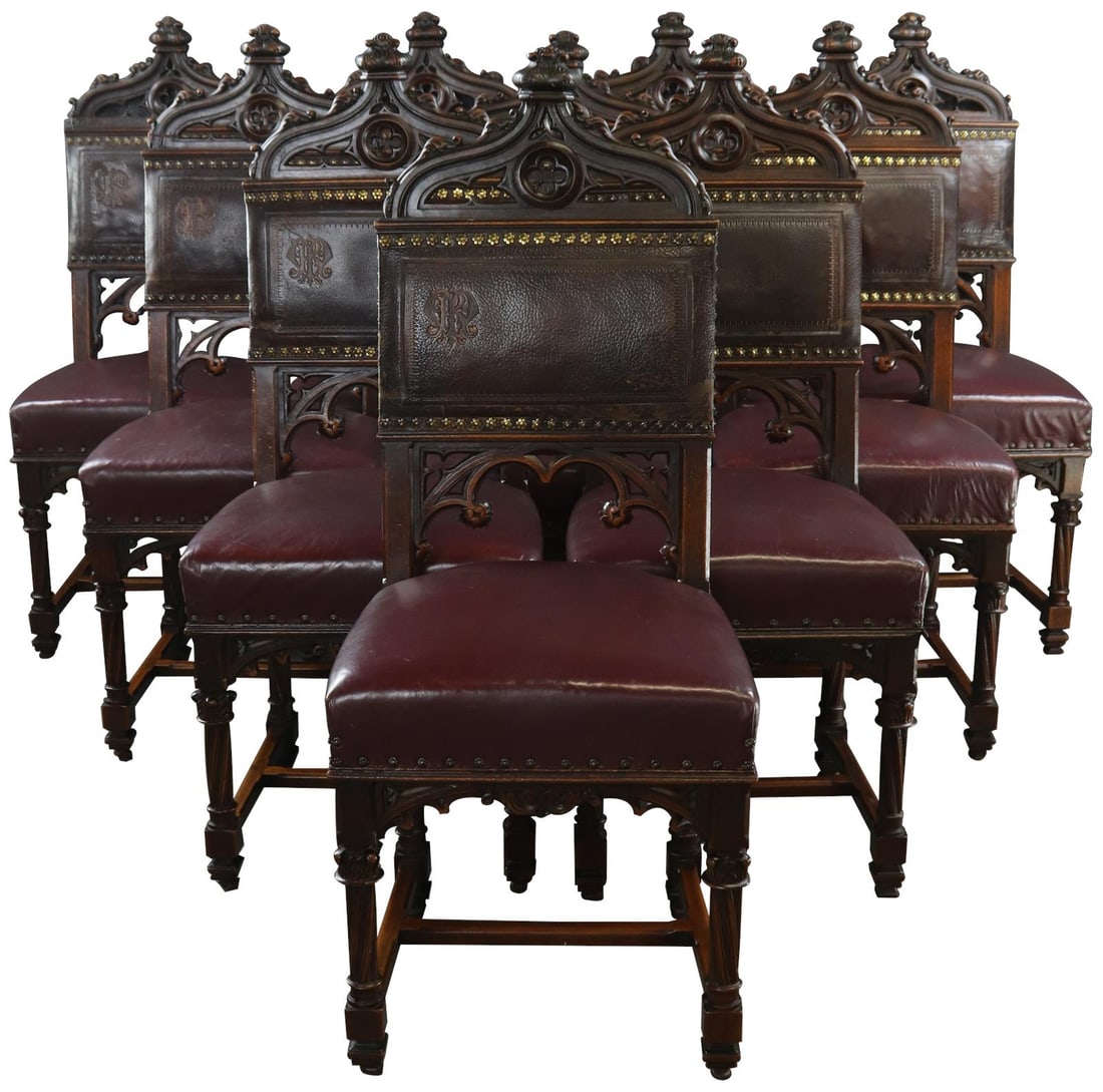 1890 Gothic Revival French Walnut Dining Chair Set with Leather Backs: 1890 Gothic Revival French Walnut Dining Chair Set with Leather Backs This exquisite set of Majestic French Walnut Dining Chairs, dating back to 1890, showcases the beautiful craftsmanship of the Goth