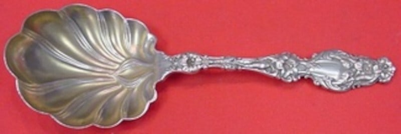 Whiting Lily Gold Washed Sterling Silver Preserve Spoon 7.5": Whiting Lily Gold Washed Sterling Silver Preserve Spoon 7.5" This exquisite serving spoon from the Lily pattern by Whiting makes an elegant addition to any table setting. Crafted from high-quality ste