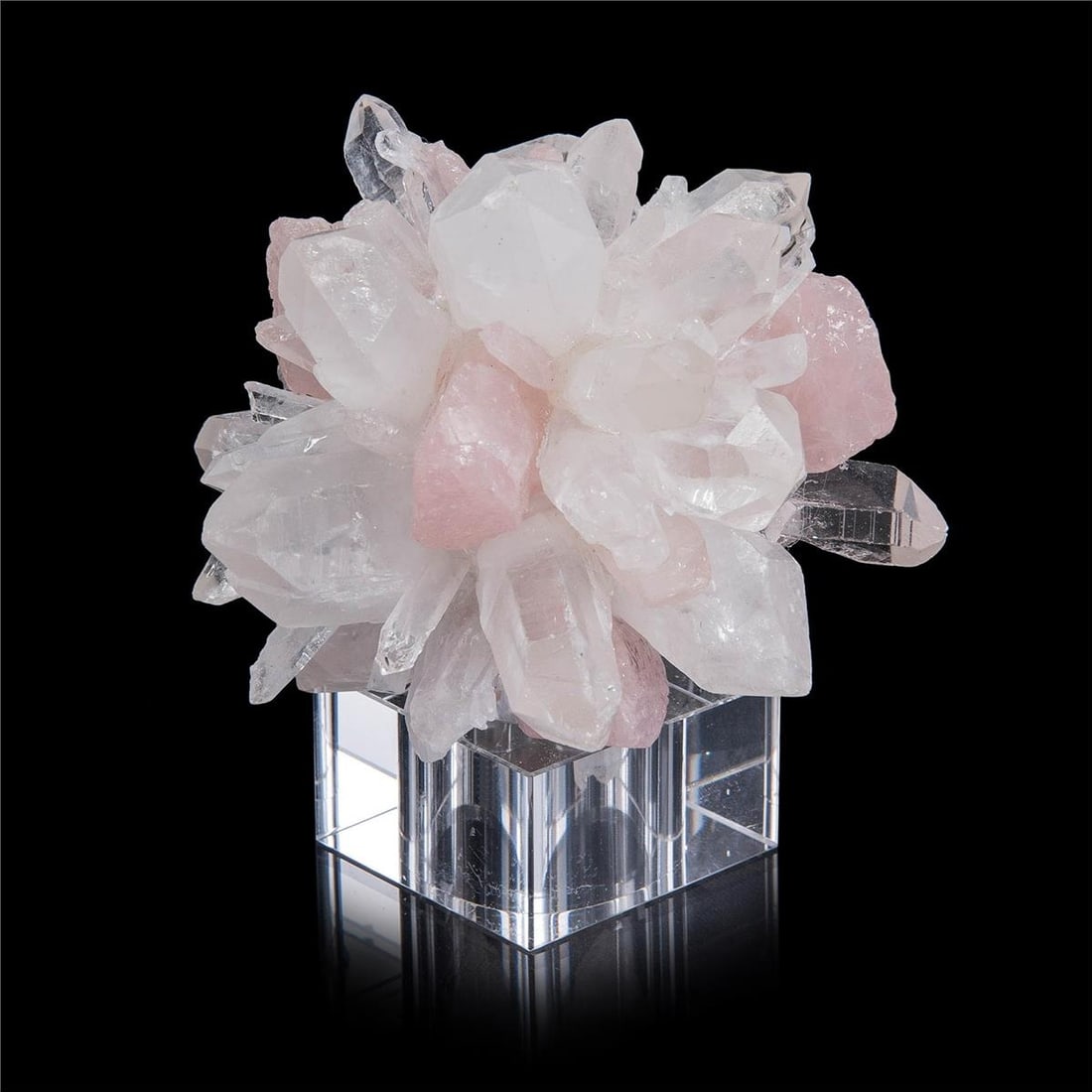 John-Richard Rose Quartz Sphere on Crystal Base 5H 4.5W 4.5D: John-Richard Rose Quartz Sphere on Crystal Base 5H 4.5W 4.5D This exquisite Rose Quartz Sphere is elegantly supported by a crystal base, crafted by John-Richard. With its soothing pink hues, the spher