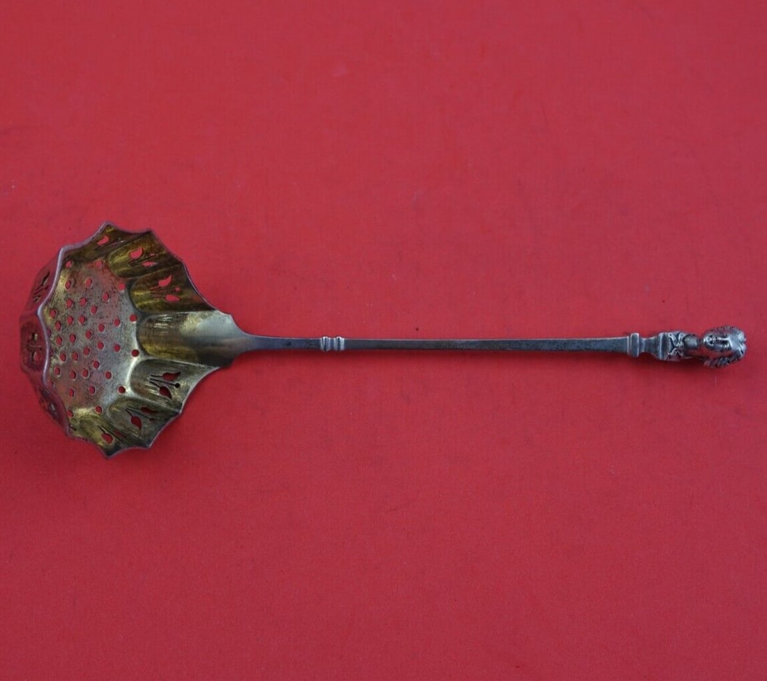 Gorham Bust Sterling Silver Gold Washed Sugar Sifter Ladle 6 3/4": Gorham Bust Sterling Silver Gold Washed Sugar Sifter Ladle 6 3/4" This exquisite sugar sifter ladle from Gorham showcases the Bust pattern and is crafted from high-quality sterling silver. Measuring 6