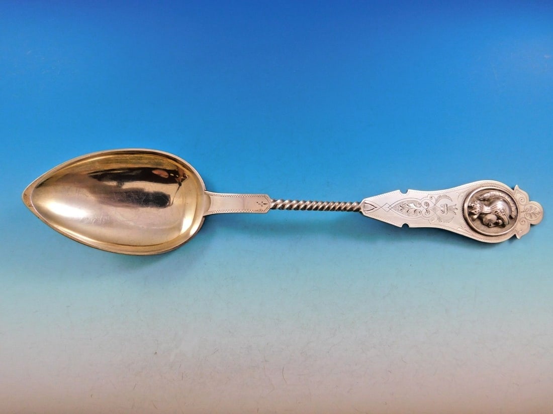 Duhme Sterling Silver 13 Inch Medallion Stuffing Spoon with Twisted Handle: Duhme Sterling Silver 13 Inch Medallion Stuffing Spoon with Twisted Handle This exquisite large stuffing spoon, crafted by Duhme, showcases remarkable craftsmanship in sterling silver. Measuring 13 in