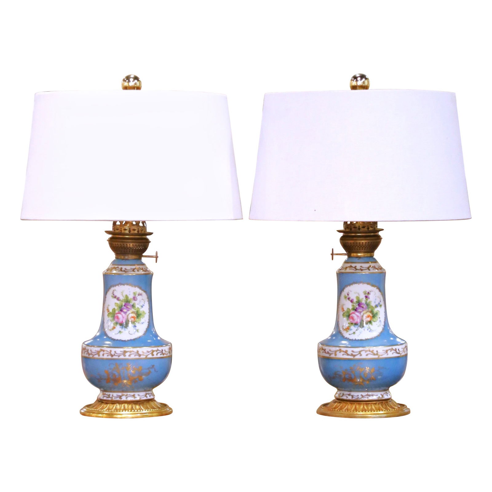 Antique Pair of 19th Century French Porcelain Oil Lamps on Bronze Bases: Antique Pair of 19th Century French Porcelain Oil Lamps on Bronze Bases Enhance your space with this exquisite pair of 19th-century French painted porcelain table oil lamps, expertly converted to elec