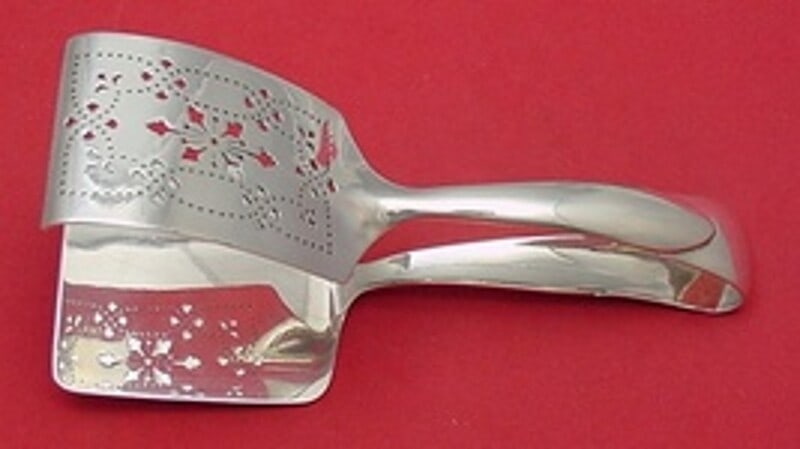 Tiffany & Co Faneuil Sterling Silver Asparagus Serving Tong 7.5": Tiffany & Co Faneuil Sterling Silver Asparagus Serving Tong 7.5" Elevate your dining experience with this exquisite Faneuil asparagus serving tong by Tiffany & Co. Crafted from high-quality sterling s