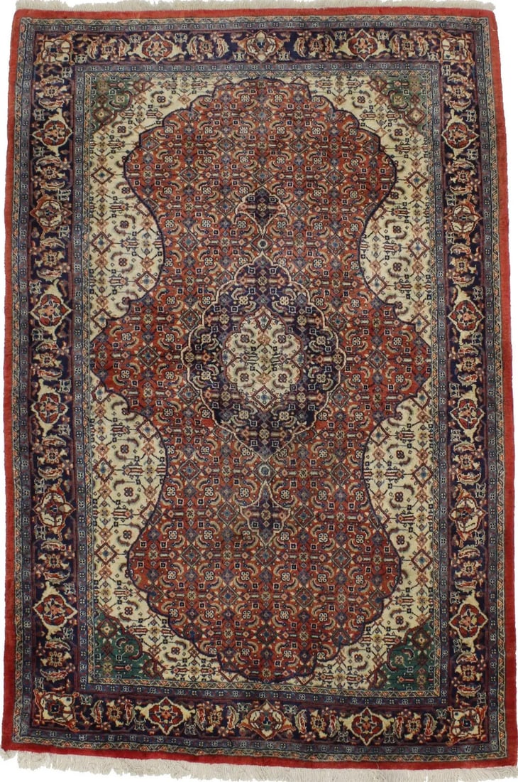 Hand-Knotted Wool Area Rug with Orange Floral and Geometric Motif 4'5 x 6'7: Hand-Knotted Wool Area Rug with Orange Floral and Geometric Motif 4'5 x 6'7 This area rug features a decorative orange floral and geometric design, hand-knotted from wool. The rug showcases a blend of