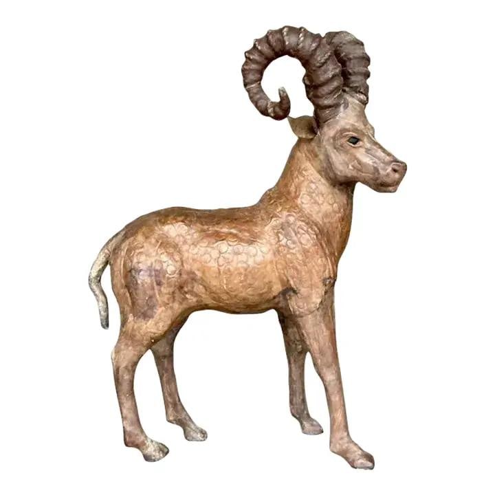 Vintage Sienna Leather Ram Decorative Accent: Vintage Sienna Leather Ram Decorative Accent This vintage leather ram is a captivating addition to any space, radiating rustic charm and nature-inspired decor. Expertly crafted, it features beautifull