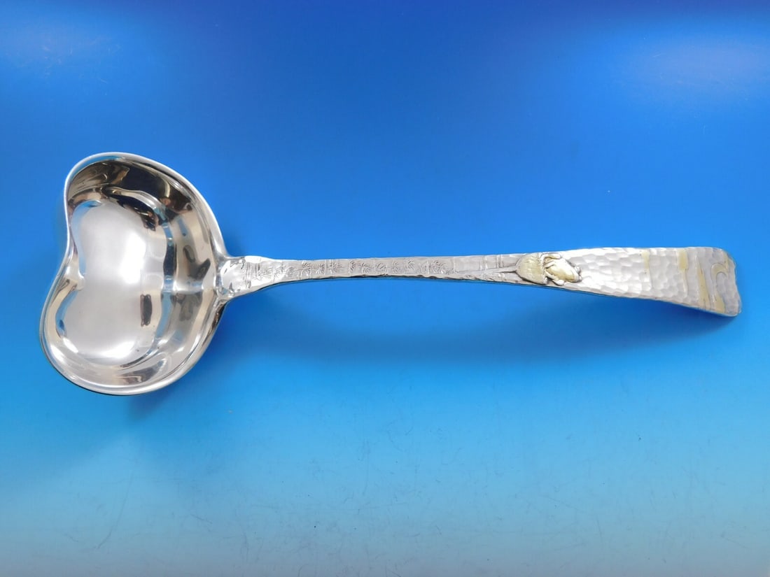 Tiffany & Co. Lap Over Edge Sterling Silver Soup Ladle with Gold Frog 11.5": Tiffany & Co. Lap Over Edge Sterling Silver Soup Ladle with Gold Frog 11.5" This exquisite ladle by Tiffany & Co. features the Lap Over Edge pattern, crafted from high-quality sterling silver. The hea