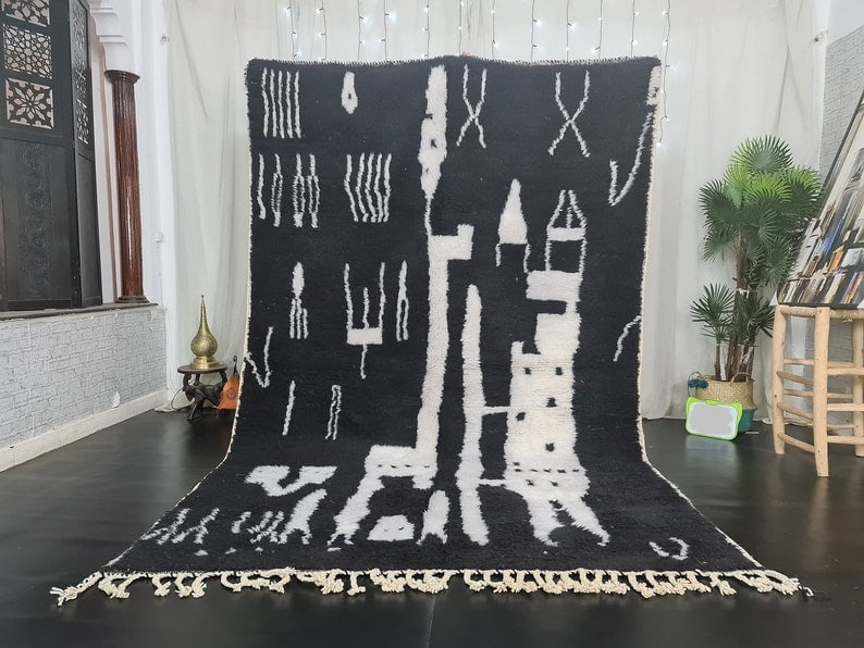 Handmade Moroccan Berber Wool Rug Black and White 9.84 x 6.56 Feet: Handmade Moroccan Berber Wool Rug Black and White 9.84 x 6.56 Feet Discover the elegance of this authentic black and white handmade Moroccan Berber wool rug. Crafted by local Berber women weavers in t