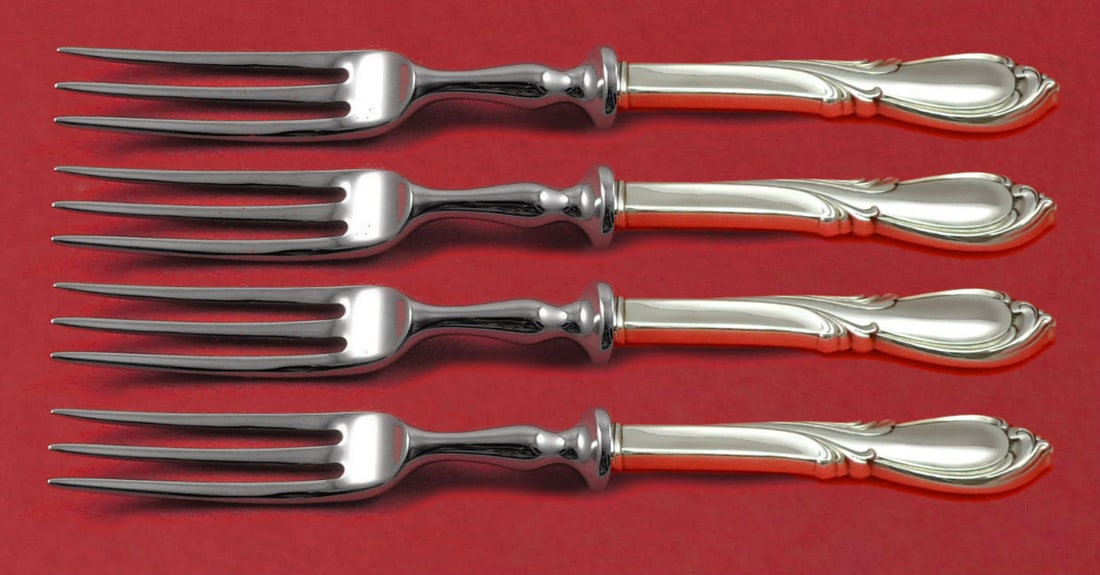 International Sterling Silver Rhapsody New 4pc Fruit Fork Set 6in: International Sterling Silver Rhapsody New 4pc Fruit Fork Set 6in Elevate your dining experience with this exquisite 4-piece fruit fork set from the Rhapsody New pattern by International. Crafted from