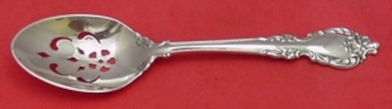 Oneida Botticelli Sterling Silver Pierced Serving Spoon 8 1/4": Oneida Botticelli Sterling Silver Pierced Serving Spoon 8 1/4" This exquisite serving spoon is part of the Botticelli pattern by Oneida, crafted from high-quality sterling silver. Measuring 8 1/4 inch