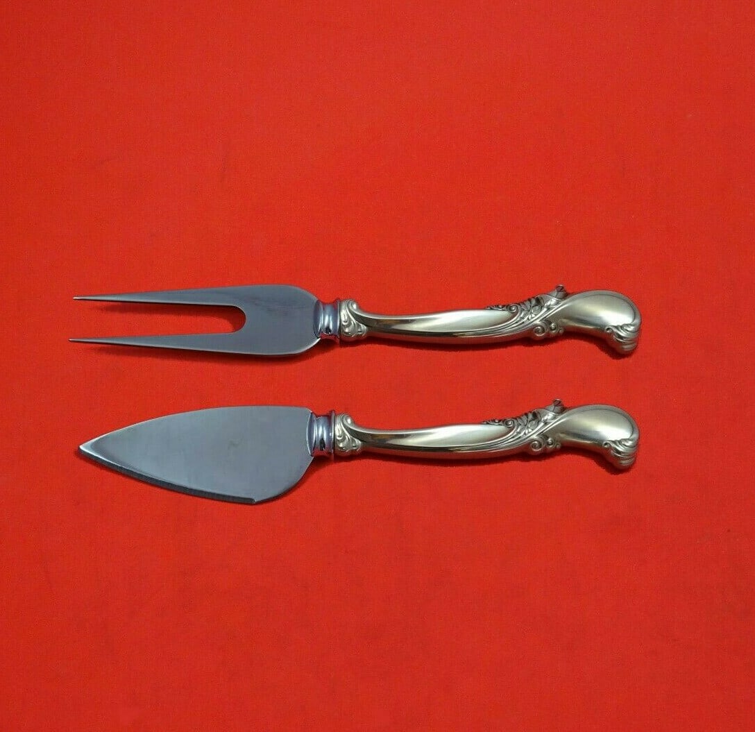 Wallace Sterling Silver Waltz of Spring Cheese Serving Set 2pc: Wallace Sterling Silver Waltz of Spring Cheese Serving Set 2pc Enhance your cheese serving experience with this exquisite 2-piece cheese serving set from Wallace, featuring the elegant "Waltz of Sprin