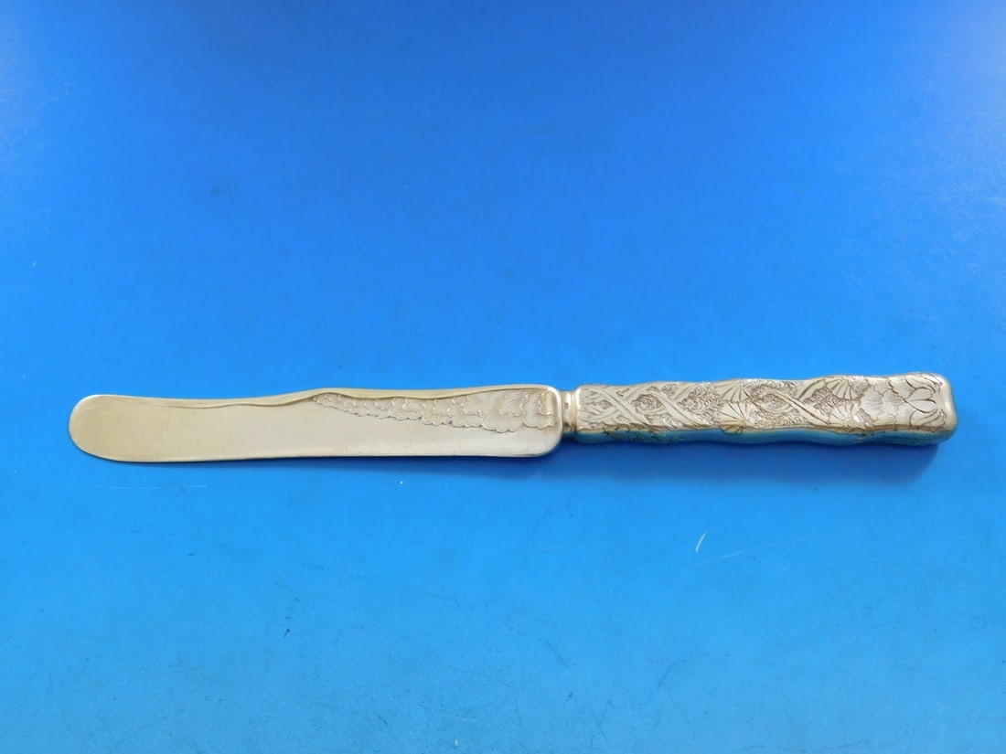 Tiffany & Co Sterling Silver Dessert Knife Lap Over Edge Vermeil Fan Shells: Tiffany & Co Sterling Silver Dessert Knife Lap Over Edge Vermeil Fan Shells This exquisite dessert knife features the iconic Lap Over Edge pattern created by Tiffany & Co. Crafted from sterling silver