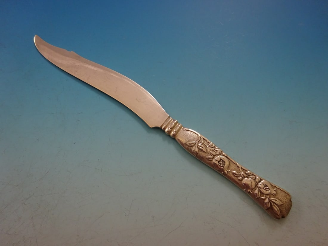 Tiffany & Co Vine Sterling Silver Fish Knife Pomegranate Design 8": Tiffany & Co Vine Sterling Silver Fish Knife Pomegranate Design 8" This exquisite fish knife from the renowned Vine pattern by Tiffany & Co. is crafted entirely from sterling silver. Dating back to th