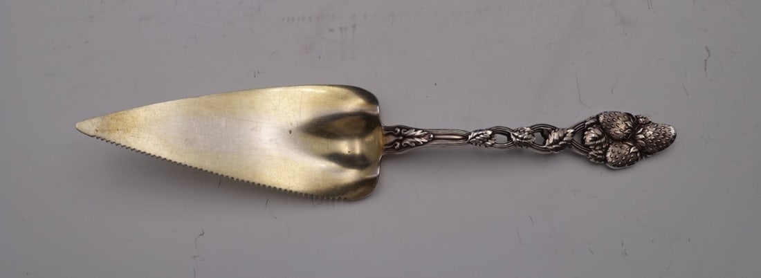Tiffany & Co. Strawberry Vine Sterling Silver Pie Server 11 1/4": Tiffany & Co. Strawberry Vine Sterling Silver Pie Server 11 1/4" Indulge in the timeless elegance of the Strawberry Vine pie server by Tiffany & Co. This exquisite piece, crafted from sterling silver,
