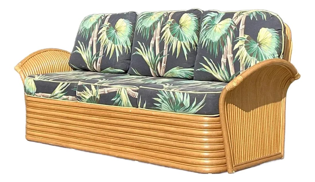 Vintage Coastal Rattan Sofa with Bold Palm Print Cushion: Vintage Coastal Rattan Sofa with Bold Palm Print Cushion Transform your living area with this stunning vintage coastal rattan sofa, elegantly blending tropical charm with classic craftsmanship. This p