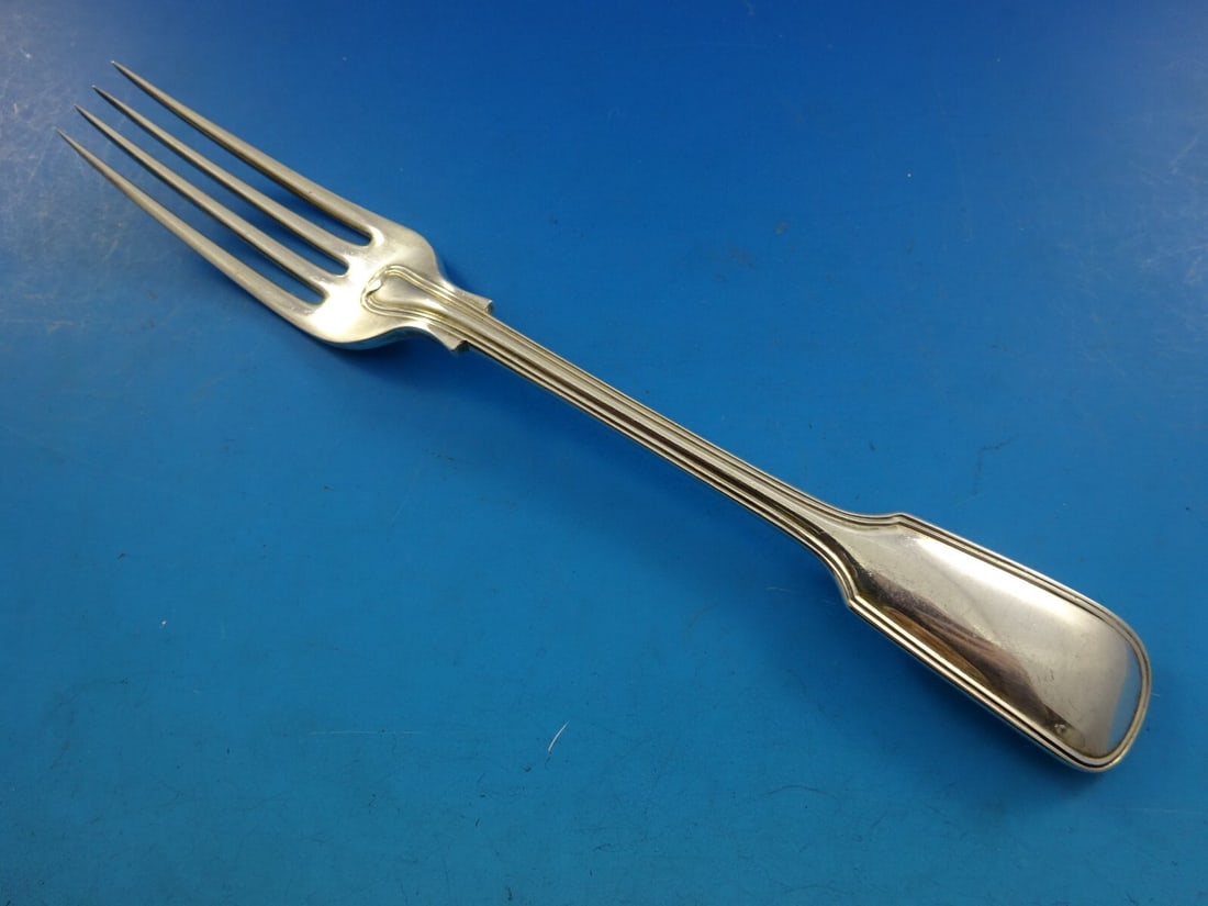 James Robinson Fiddle Thread Sterling Silver Dinner Fork 4-Tine 7 3/4": James Robinson Fiddle Thread Sterling Silver Dinner Fork 4-Tine 7 3/4" This exquisite dinner fork from James Robinson showcases the elegant Fiddle Thread pattern. Crafted from high-quality sterling si