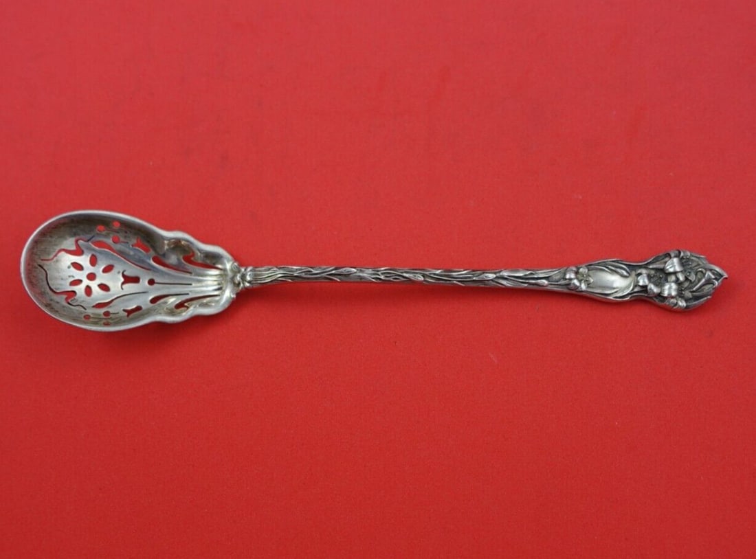 Watson Lily Sterling Silver Olive Spoon 5 7/8 inches Pierced Flower: Watson Lily Sterling Silver Olive Spoon 5 7/8 inches Pierced Flower Discover the elegant 'Lily' pattern by Watson, featuring a stunning sterling silver slotted olive spoon, measuring 5 7/8 inches. Thi