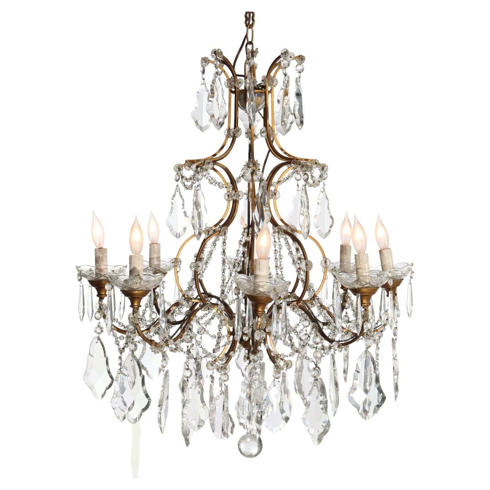 Eight-Light Brass and Italian Cut Crystal Chandelier in Louis XIV Motif: Eight-Light Brass and Italian Cut Crystal Chandelier in Louis XIV Motif This antique chandelier features a French Louis XIV style, crafted with brass and Italian cut crystal. Dating to around 1930, it