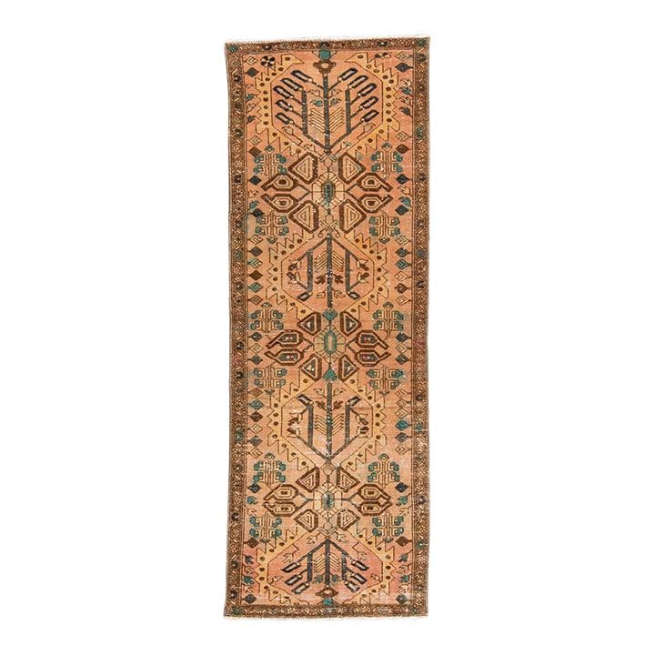 1960s Handmade Tribal Peach Wool Runner 3'6 x 9'11 Distressed Design: 1960s Handmade Tribal Peach Wool Runner 3'6 x 9'11 Distressed Design This stunning vintage tribal runner features a hand-knotted wool construction with a warm peach field. Accented with blue and brown