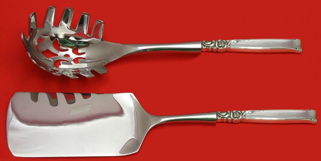 Oneida Silver Rose Sterling Silver 2pc Italian Pasta Server Set: Oneida Silver Rose Sterling Silver 2pc Italian Pasta Server Set Enhance your dining experience with this exquisite Silver Rose Hostess Set by Oneida. This two-piece Italian pasta server set includes a