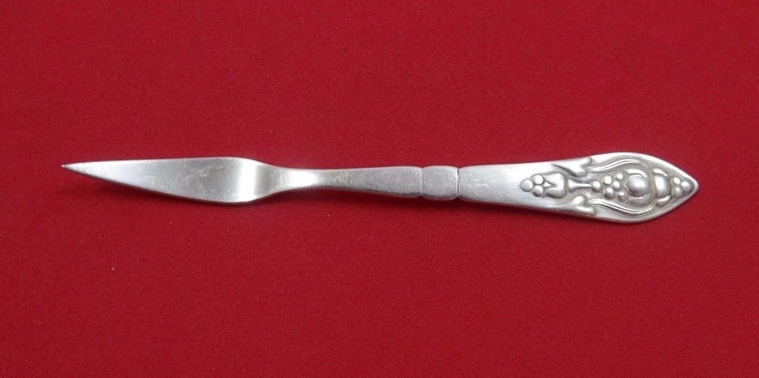 Georg Jensen Fuchsia Sterling Silver Nut Pick 4 inches GI Mark: Georg Jensen Fuchsia Sterling Silver Nut Pick 4 inches GI Mark This exquisite nut pick from the Fuchsia collection by Georg Jensen is crafted from high-quality sterling silver and features the iconic
