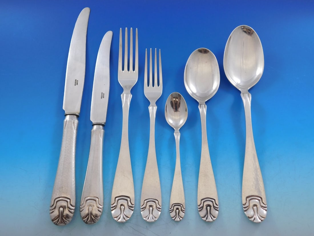 J Tostrup Hammered Shell 39 Piece Sterling Silver Flatware Set: J Tostrup Hammered Shell 39 Piece Sterling Silver Flatware Set Discover the exquisite Hammered Shell flatware set by J Tostrup, crafted from sterling silver. This stunning Mid-Century Modern set showc