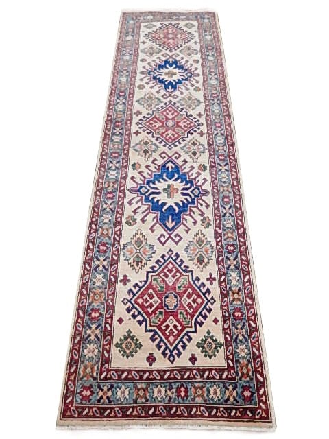 Handmade 2.6 x 9.5 Ivory Kazak Runner Rug with Cobalt Blue and Red: Handmade 2.6 x 9.5 Ivory Kazak Runner Rug with Cobalt Blue and Red Free continental US Shipping Introducing the captivating 2.6 x 9.5 Ivory Narrow Kazak Runner Rug, a testament to timeless elegance an