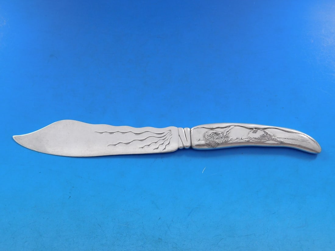Tiffany & Co. Sterling Silver Lap Over Edge Fish Knife 7 7/8": Tiffany & Co. Sterling Silver Lap Over Edge Fish Knife 7 7/8" This exquisite fish knife from Tiffany & Co. features the distinctive Lap Over Edge pattern, crafted from all-sterling silver. The hollow