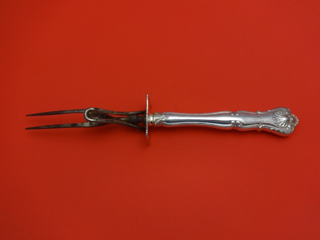 Durgin New Queens Sterling Silver Roast Carving Fork 10.5": Durgin New Queens Sterling Silver Roast Carving Fork 10.5" Enhance your dining experience with this exquisite Sterling Silver Roast Carving Fork, crafted by Durgin in the elegant New Queens pattern. T