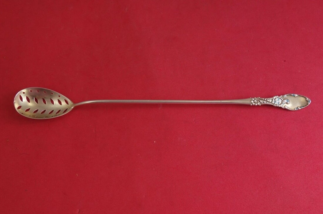 Frank Whiting Tyrolean Sterling Silver Olive Spoon with Enamel 9": Frank Whiting Tyrolean Sterling Silver Olive Spoon with Enamel 9" This exquisite serving spoon features the Tyrolean pattern by Frank M. Whiting, crafted from sterling silver with light vermeil and ad