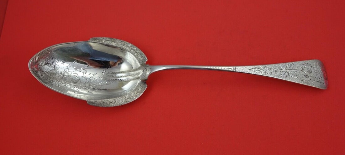 Brite-Cut Sterling Silver Serving Spoon 12 Inch Floral Design: Brite-Cut Sterling Silver Serving Spoon 12 Inch Floral Design This exquisite serving spoon features a stunning Brite-cut pattern with bright cut flowers design on the shoulders. Crafted from high-qual