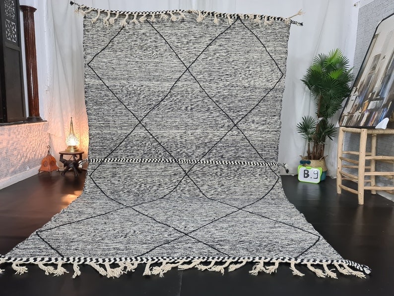 Authentic Handwoven Moroccan Berber Rug 100% Sheep Wool 9.84 x 6.56 Feet: Authentic Handwoven Moroccan Berber Rug 100% Sheep Wool 9.84 x 6.56 Feet Discover the exquisite craftsmanship of this authentic handmade Moroccan Berber rug. Handwoven in the Atlas Mountains by skille