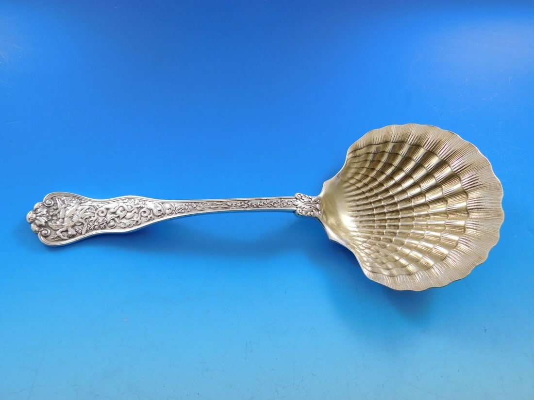 Tiffany & Co Olympian Sterling Silver Berry Spoon with Light Gold Wash: Tiffany & Co Olympian Sterling Silver Berry Spoon with Light Gold Wash This exquisite berry spoon from the Olympian pattern by Tiffany & Co. is crafted in sterling silver and features a light gold was
