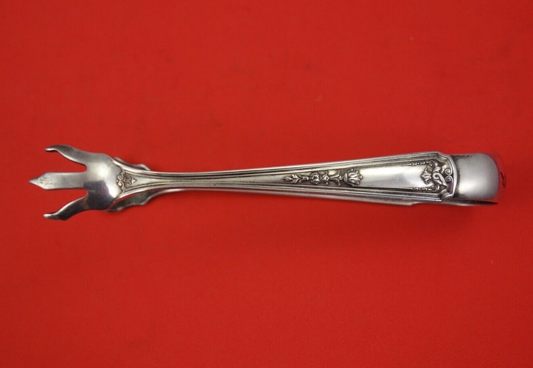 Whiting Oriana Sterling Silver Sugar Tongs 5 Inch Serving Piece: Whiting Oriana Sterling Silver Sugar Tongs 5 Inch Serving Piece Enhance your dining experience with these exquisite Oriana sterling silver sugar tongs by Whiting. Crafted from high-quality sterling si