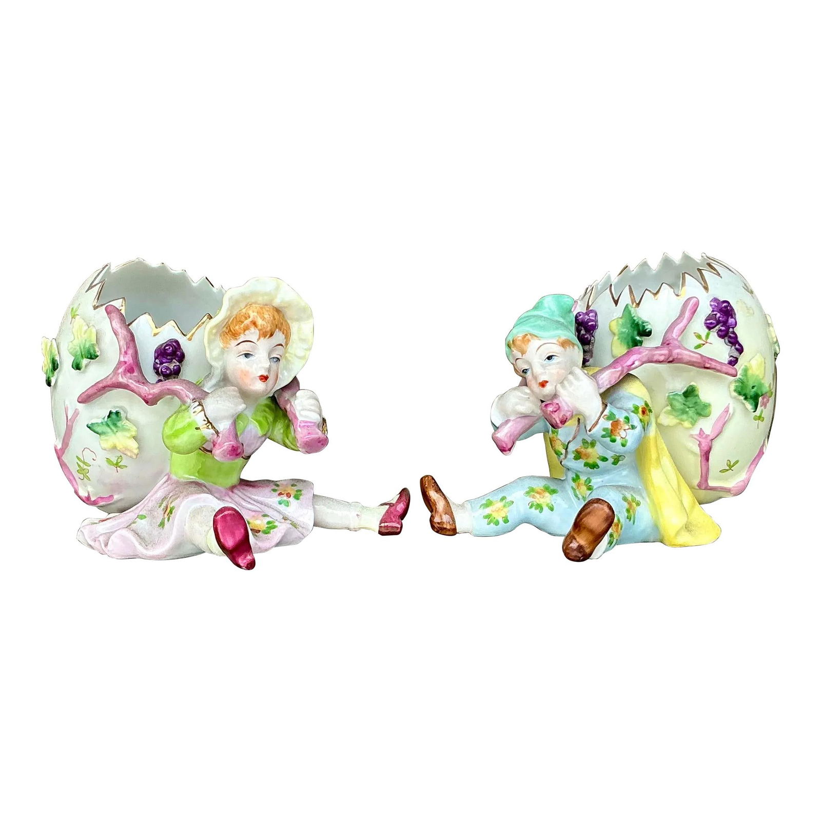 Charming Vintage Regency Hand Painted Egg Figurine Set of 2: Charming Vintage Regency Hand Painted Egg Figurine Set of 2 Enhance your home decor with this charming set of two vintage Regency-era hand-painted porcelain egg figurines. Each figurine features a del