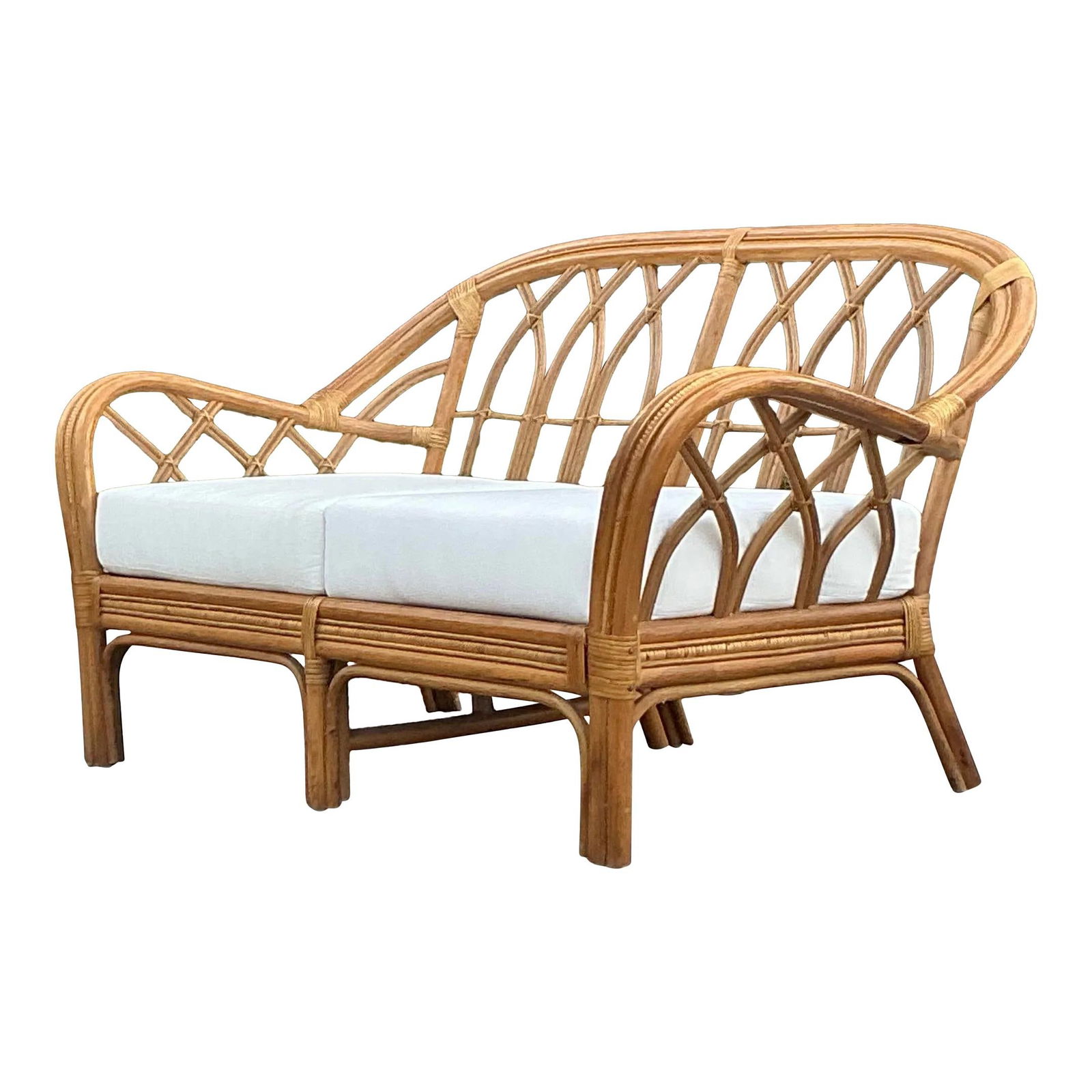Vintage Coastal Rattan Loveseat Charming Beachside Design: Vintage Coastal Rattan Loveseat Charming Beachside Design Experience the charm of coastal living with this vintage bent rattan loveseat. Featuring a gracefully curved frame crafted from natural rattan