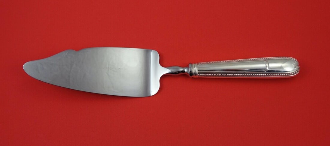 Joubert Christofle Sterling Silver Cake Pie Server 10 3/4": Joubert Christofle Sterling Silver Cake Pie Server 10 3/4" Experience elegance with the Joubert by Christofle Sterling Silver Pie Server. Crafted from high-quality sterling silver, this exquisite cake