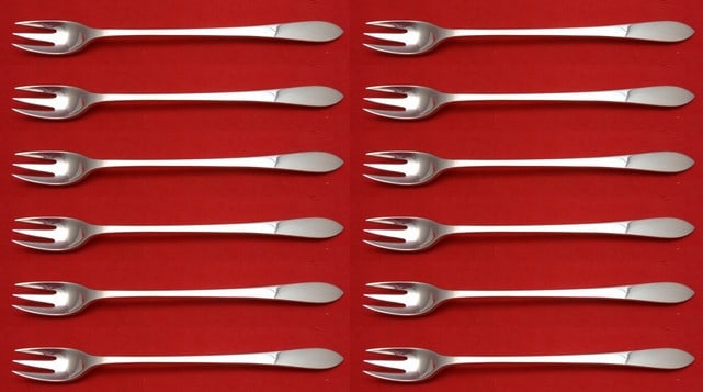 Tiffany & Co Faneuil Sterling Silver Cocktail Forks Set of 12: Tiffany & Co Faneuil Sterling Silver Cocktail Forks Set of 12 Enhance your dining experience with this elegant set of 12 cocktail forks from Tiffany & Co. Crafted from high-quality sterling silver, th