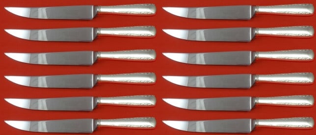 Gorham Camellia Sterling Silver Steak Knife Set 12 pcs 8 1/2 in: Gorham Camellia Sterling Silver Steak Knife Set 12 pcs 8 1/2 in This exquisite set of 12 steak knives features the elegant Camellia pattern by Gorham. Crafted with sterling silver hollow handles and s