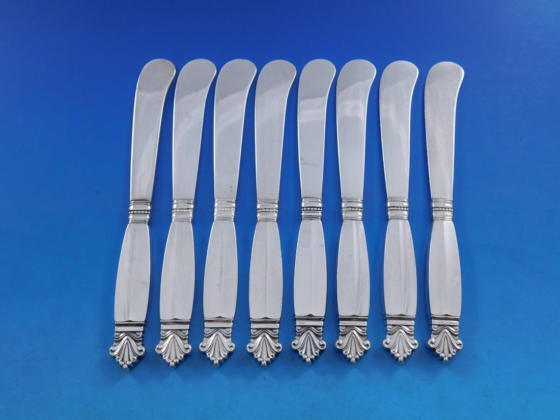Georg Jensen Acanthus Sterling Silver Butter Spreader Set 8 pcs: Georg Jensen Acanthus Sterling Silver Butter Spreader Set 8 pcs Elevate your dining experience with this exquisite set of 8 butter spreaders from the renowned Acanthus pattern by Georg Jensen. Each pi