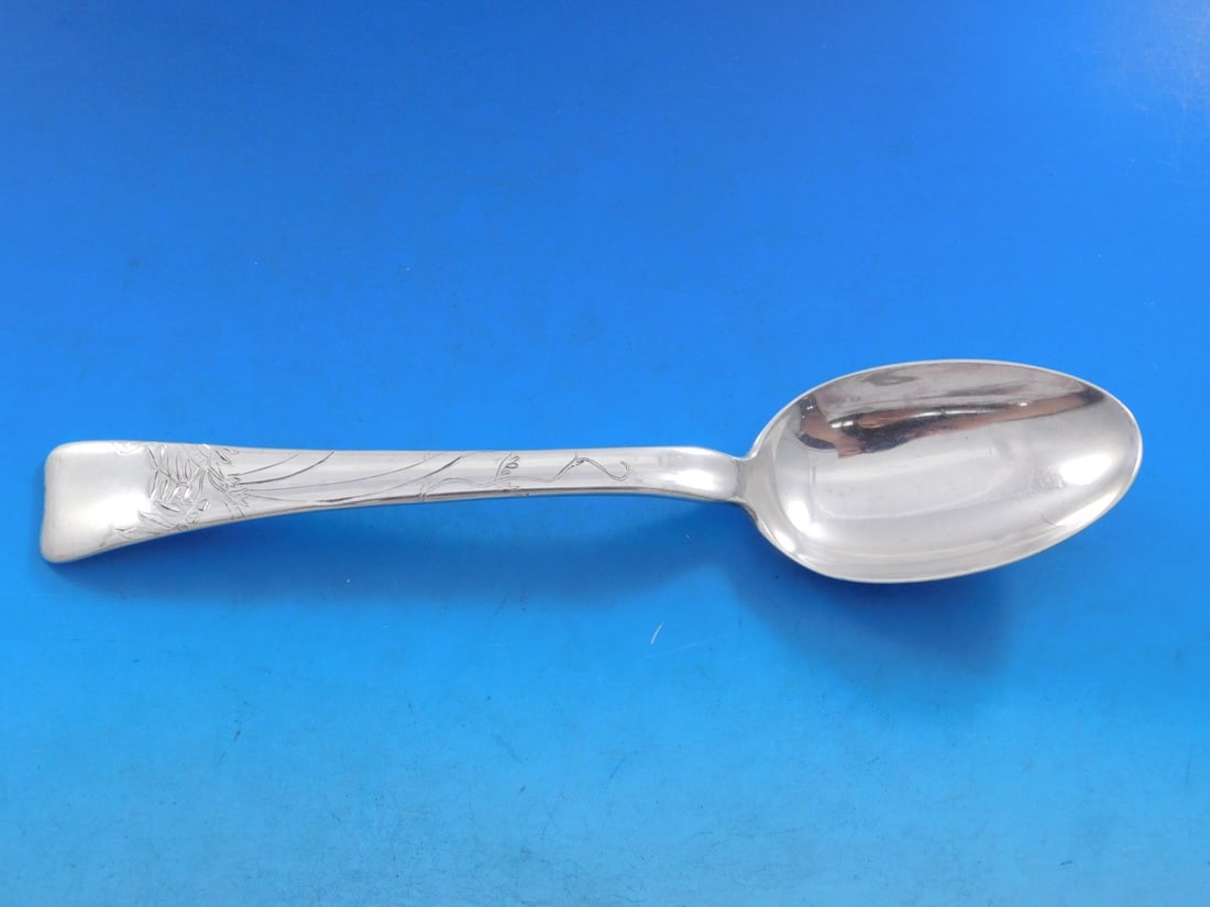 Tiffany Sterling Silver Serving Spoon Lap Over Edge 8 5/8 inches: Tiffany Sterling Silver Serving Spoon Lap Over Edge 8 5/8 inches This exquisite serving spoon, crafted by Tiffany & Co., features the elegant Lap Over Edge pattern with intricate acid etching of leave