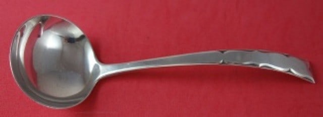 Kirk Skylark Sterling Silver Gravy Ladle 7 1/8 Inch: Kirk Skylark Sterling Silver Gravy Ladle 7 1/8 Inch This exquisite gravy ladle from the Skylark pattern by Kirk is crafted from high-quality sterling silver. Measuring 7 1/8 inches, it features a clas